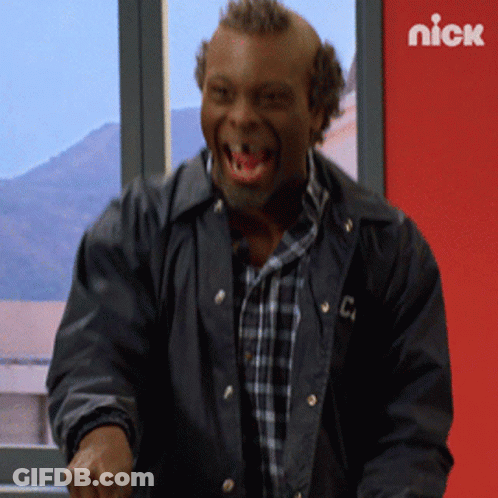 A Man In A Black Jacket With The Letter C On The Front GIF
