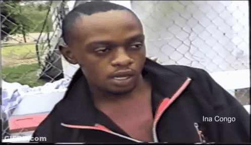 A Man In A Black Jacket With The Name Ina Congo On The Bottom Right GIF