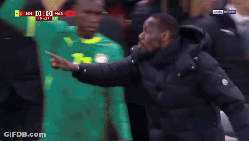 A Man In A Black Jacket With The Word Caf On The Front GIF