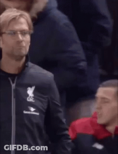 A Man In A Black Jacket With The Word Liverpool On It GIF