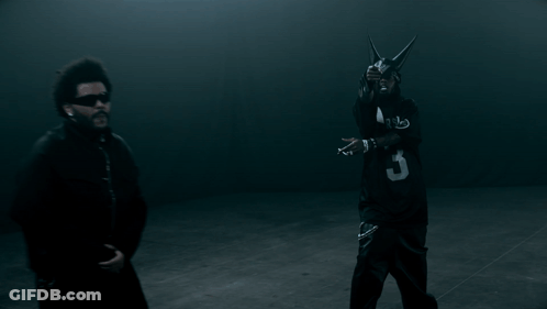 A Man In A Black Jersey With The Number 3 On It Stands Next To Another Man GIF