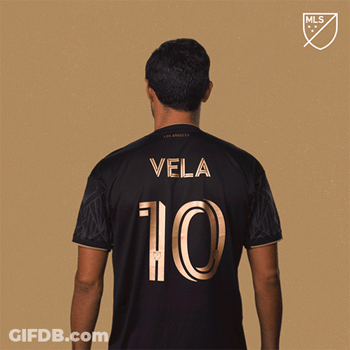 A Man In A Black Jersey With Vela 10 On The Back GIF