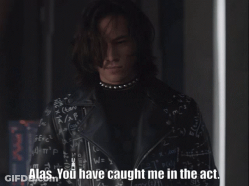 A Man In A Black Leather Jacket Says Alas GIF