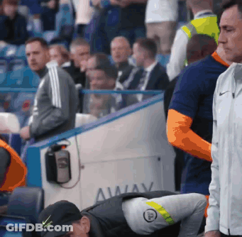 A Man In A Black Nike Hat Is Looking Down GIF