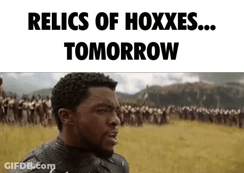 A Man In A Black Panther Costume Is Standing In A Field With A Crowd Of People . GIF