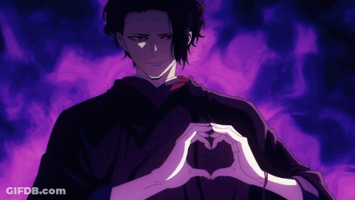 A Man In A Black Robe Is Making A Heart With His Hands GIF