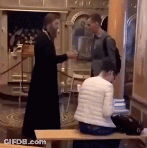 A Man In A Black Robe Is Shaking Hands With A Woman In A White Jacket GIF