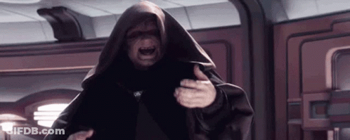 A Man In A Black Robe Is Standing In A Room With His Mouth Open . GIF