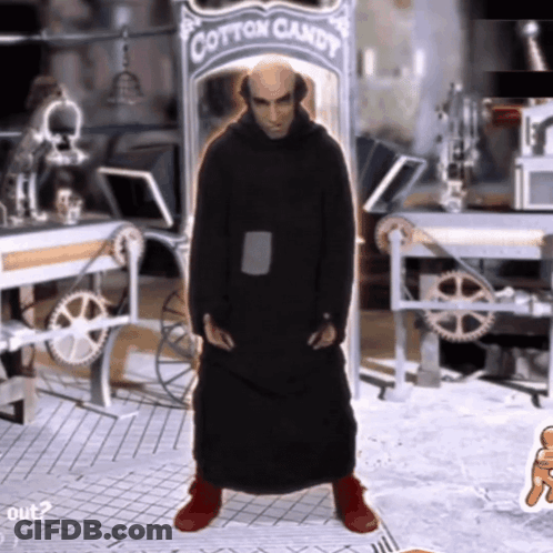 A Man In A Black Robe Stands In Front Of A Cotton Candy Sign GIF