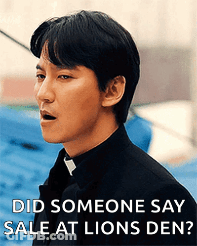 A Man In A Black Shirt And Tie Is Asking If Someone Said Sale At Lions Den GIF