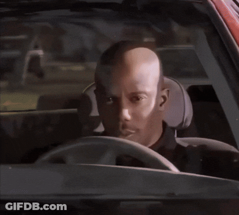A Man In A Black Shirt Has A Badge On His Shoulder GIF