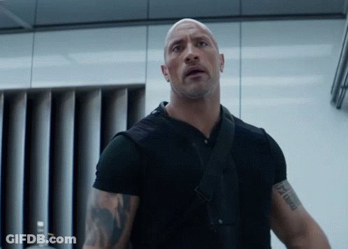A Man In A Black Shirt Has A Tattoo On His Arm That Says " I Am A Man " GIF