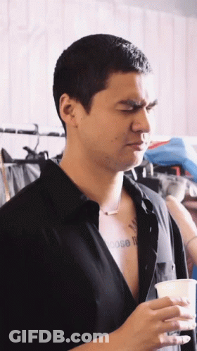 A Man In A Black Shirt Has A Tattoo On His Chest That Says Choose It GIF