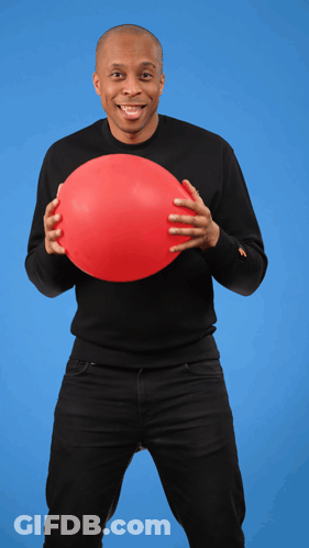 A Man In A Black Shirt Holds A Red Balloon In His Hands GIF