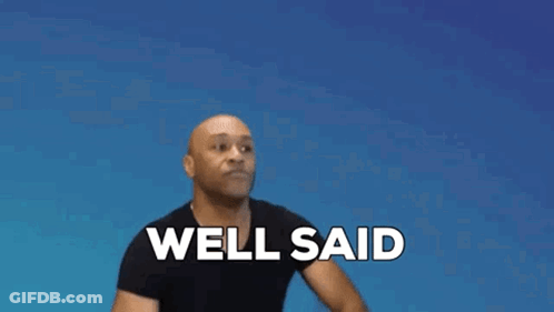 A Man In A Black Shirt Is Clapping His Hands And Saying Well Said . GIF
