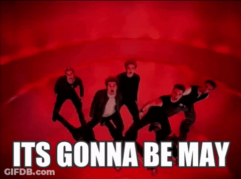 A Man In A Black Shirt Is Dancing In Front Of A Red Background . GIF