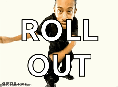 A Man In A Black Shirt Is Dancing In Front Of A Sign That Says Roll Out GIF