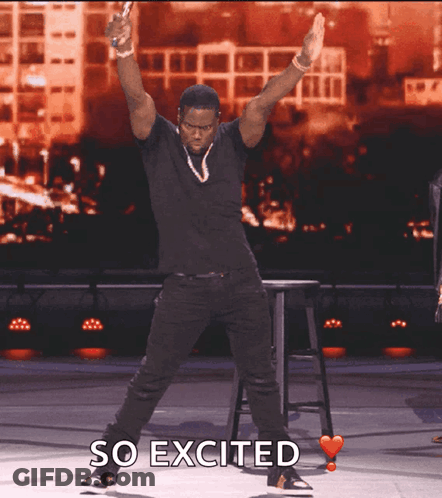 A Man In A Black Shirt Is Dancing With The Words So Excited Above Him GIF