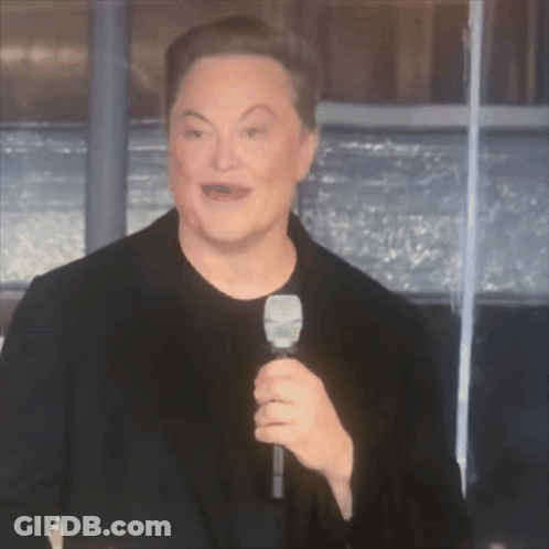 A Man In A Black Shirt Is Holding A Microphone GIF