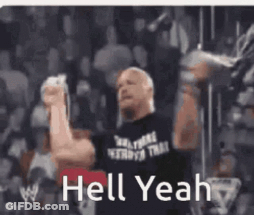 A Man In A Black Shirt Is Holding His Fist In The Air With The Words Hell Yeah Below Him GIF