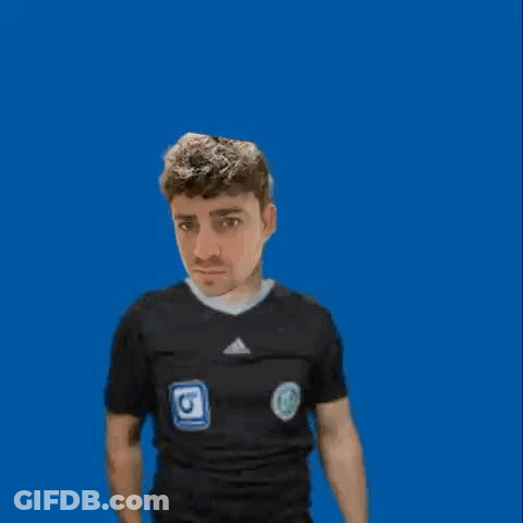 A Man In A Black Shirt Is Holding Up An Orange Card GIF