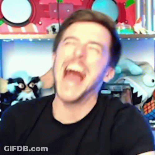 A Man In A Black Shirt Is Laughing With His Mouth Wide Open . GIF