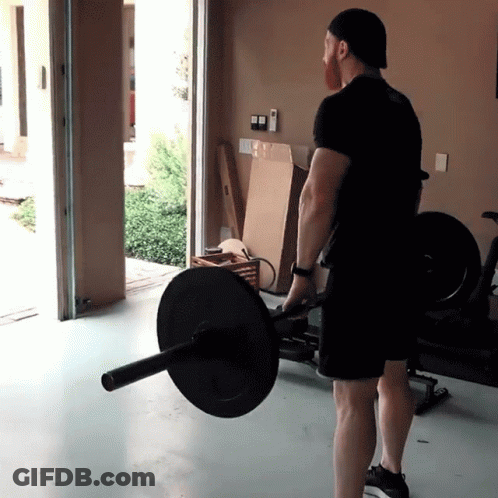 A Man In A Black Shirt Is Lifting A Barbell GIF