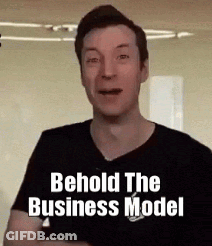A Man In A Black Shirt Is Making A Funny Face And Saying Behold The Business Model . GIF