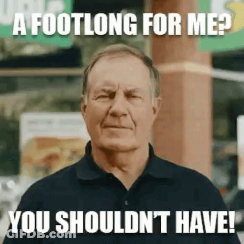 A Man In A Black Shirt Is Making A Funny Face While Standing In Front Of A Subway Sign . GIF