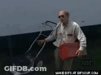A Man In A Black Shirt Is Opening A Door GIF
