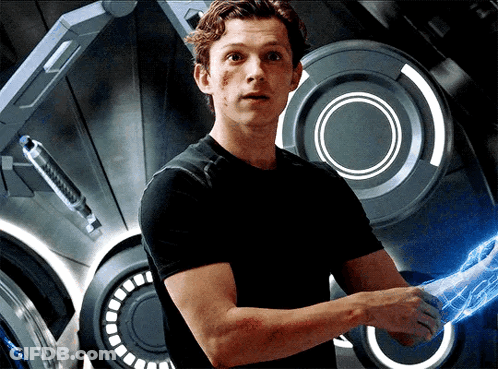 A Man In A Black Shirt Is Shaking Someone 'S Hand With A Blue Light Behind Him GIF