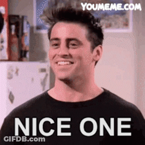 A Man In A Black Shirt Is Smiling And Says Nice One On The Bottom GIF