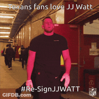 A Man In A Black Shirt Is Standing In A Hallway With The Words " Texans Fans Love Jj Watt " On The Bottom GIF