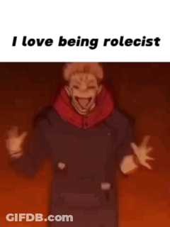 A Man In A Black Shirt Is Standing In Front Of A Red Background With The Words `` I Love Being Rolecast '' . GIF