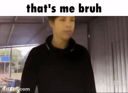 A Man In A Black Shirt Is Standing In Front Of A Sign That Says " That 'S Me Bruh " GIF