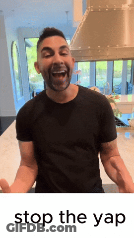 A Man In A Black Shirt Is Standing In Front Of A Stove With The Words " Stop The Yap " Below Him GIF