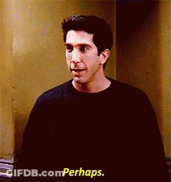 A Man In A Black Shirt Is Standing In Front Of A Wall And Says Perhaps . GIF