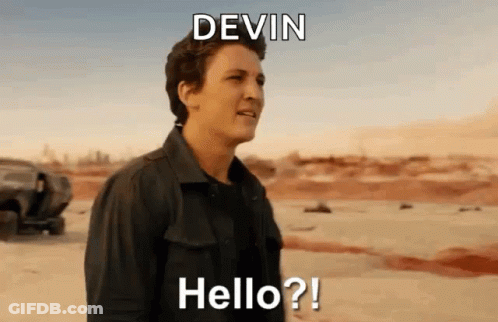 A Man In A Black Shirt Is Standing In The Desert And Says Hello ? GIF