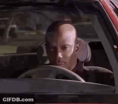 A Man In A Black Shirt Is Standing Next To A Police Officer . GIF