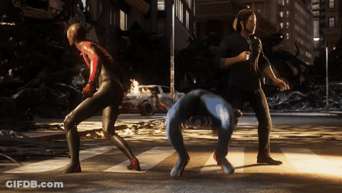 A Man In A Black Shirt Is Standing Next To A Spider Man GIF