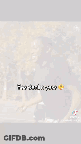 A Man In A Black Shirt Is Standing On A Basketball Court With His Arms Outstretched . GIF