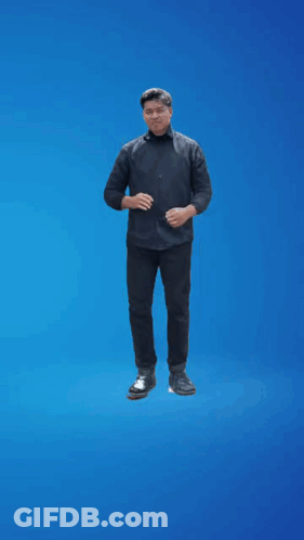 A Man In A Black Shirt Is Standing On A Blue Background GIF