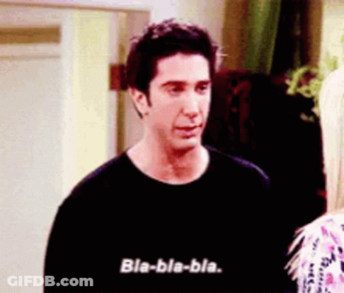 A Man In A Black Shirt Is Talking To A Blonde Woman . GIF