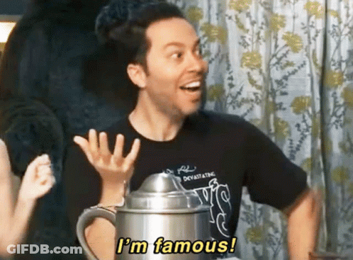 A Man In A Black Shirt Says " I 'M Famous " While Holding A Pitcher GIF