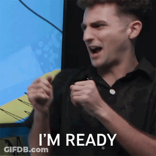 A Man In A Black Shirt Says I 'M Ready With His Fist In The Air GIF