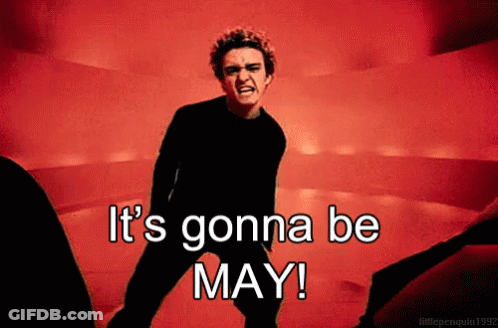 A Man In A Black Shirt Says It 'S Gonna Be May In A Red Background GIF