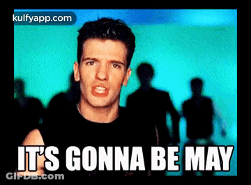 A Man In A Black Shirt Says It 'S Gonna Be May In Front Of A Crowd Of People GIF