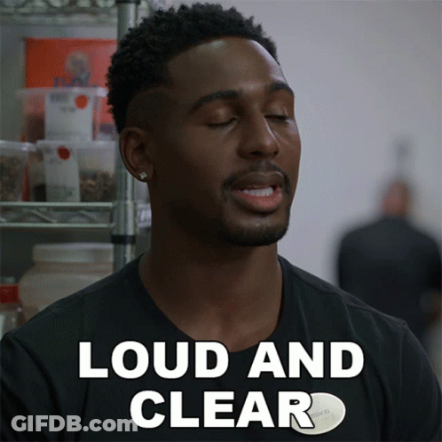 A Man In A Black Shirt Says " Loud And Clear " In White Letters GIF