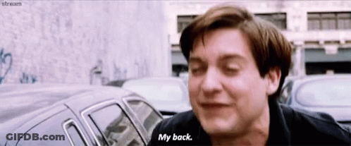 A Man In A Black Shirt Says " My Back " GIF