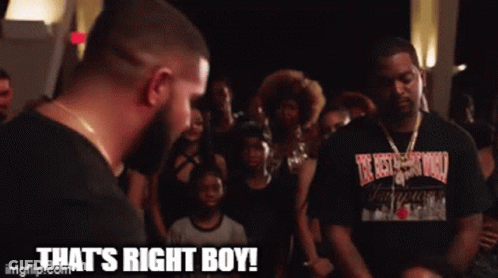 A Man In A Black Shirt Says That 'S Right Boy In Front Of A Crowd Of People GIF